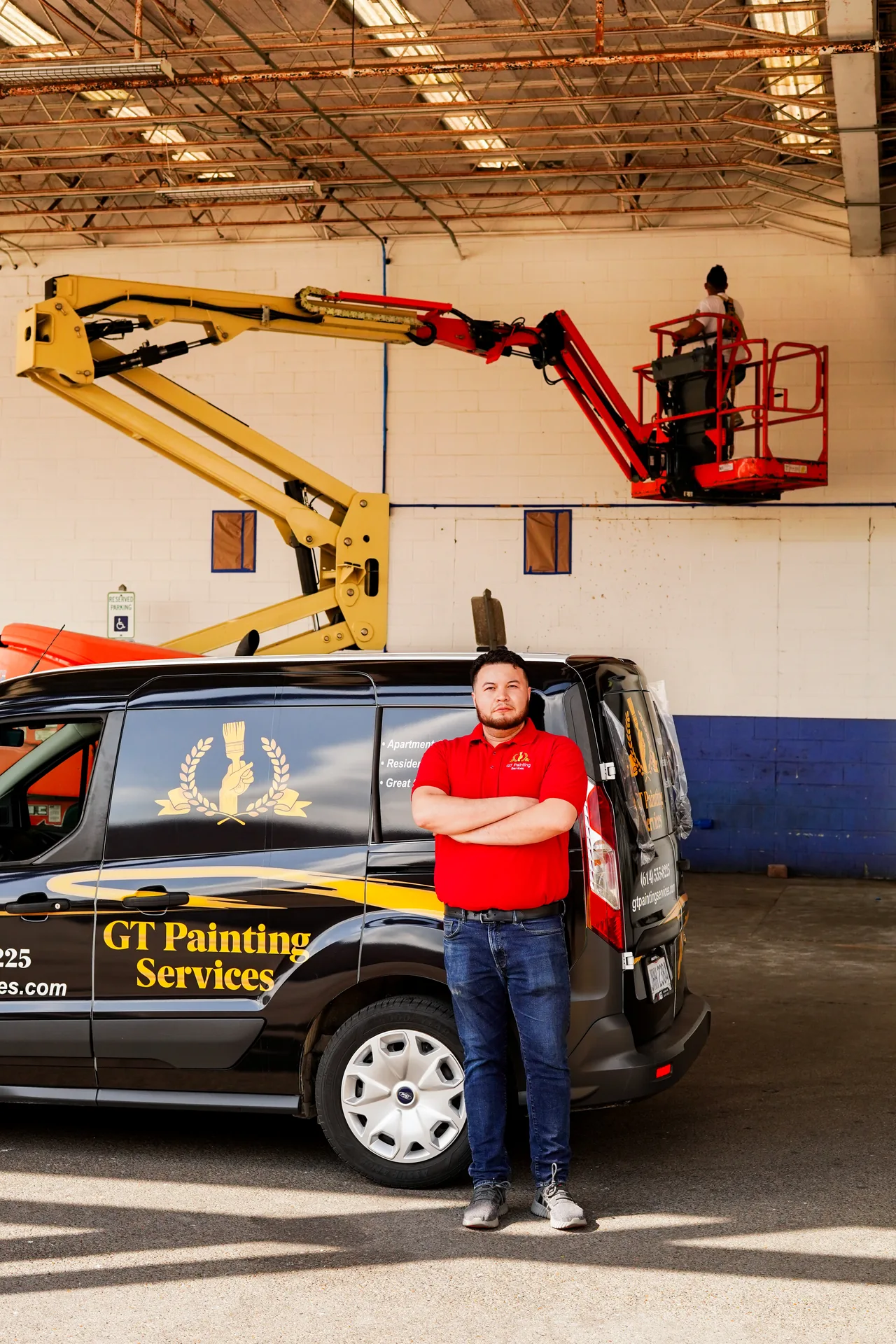 GT Painting Services founder standing beside the company van